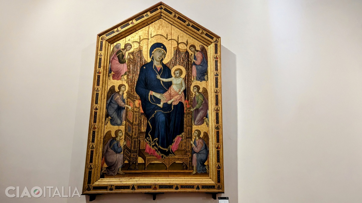 Duccio - Fecioara cu Iisus pe tron și îngeri (1285). Pictura mai este numită și "Madonna Rucellai", după numele capelei în care a fost așezată la sfârșitul sec. al XVI-lea.